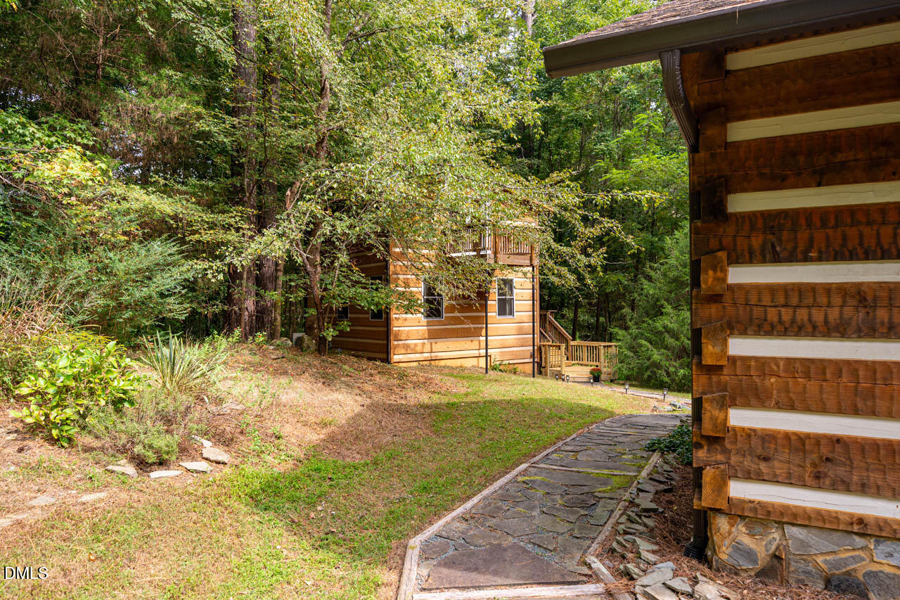 1114 Phil's Ridge Road Chapel Hill, NC 27516 - Photo 31 of 52 a view of a house with a yard