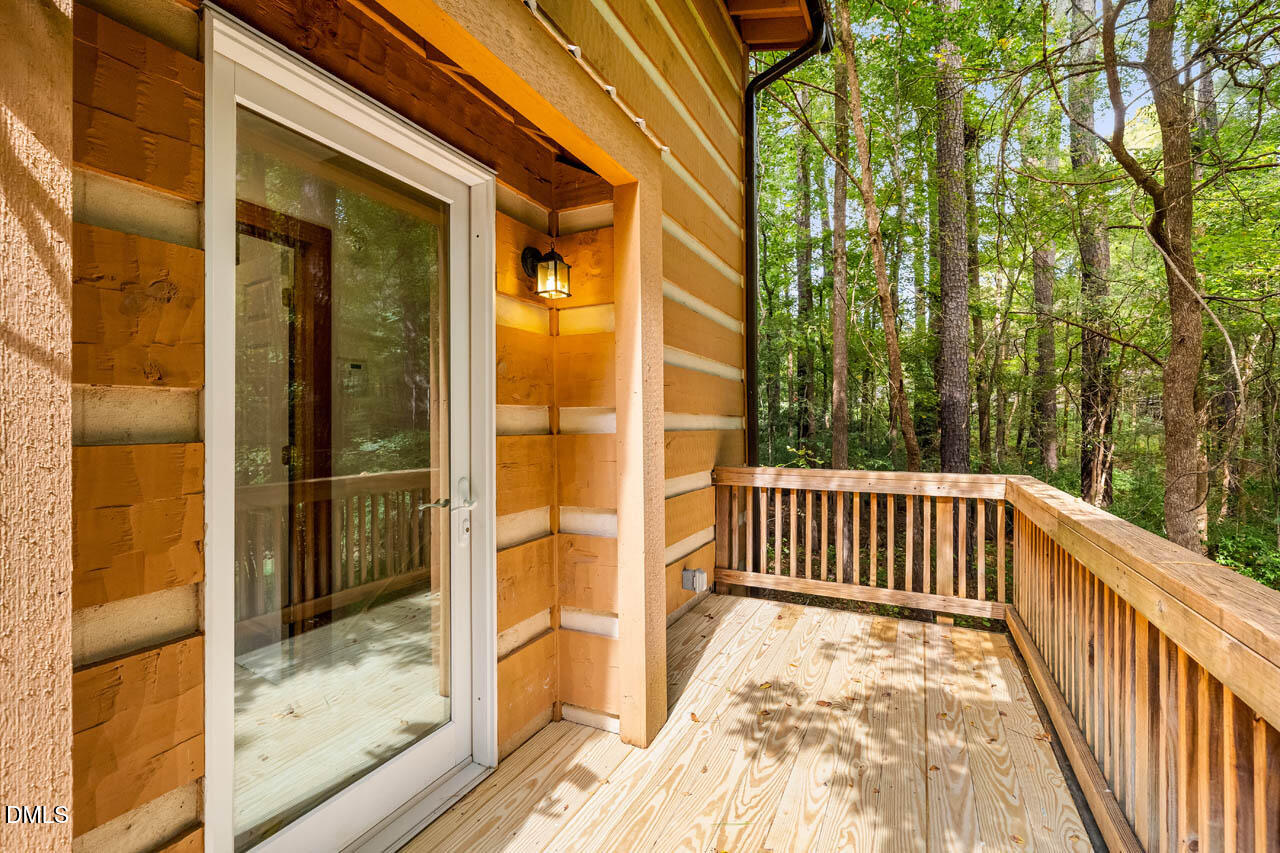 1114 Phil's Ridge Road Chapel Hill, NC 27516 - Photo 33 of 52 a view of a balcony with a swing