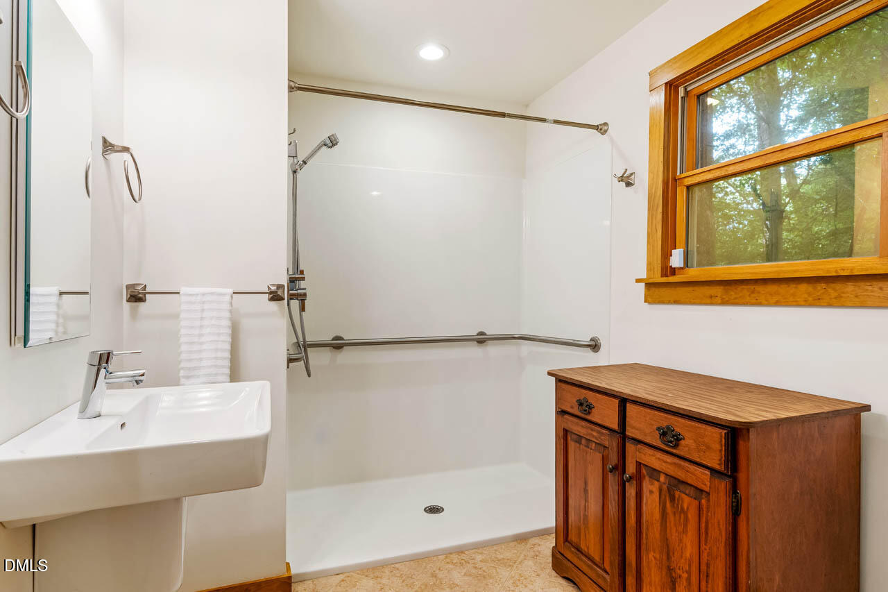 1114 Phil's Ridge Road Chapel Hill, NC 27516 - Photo 36 of 52 a bathroom with a sink and a shower
