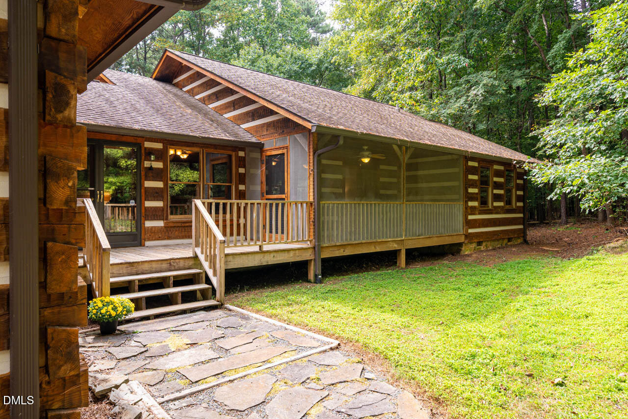 1114 Phil's Ridge Road Chapel Hill, NC 27516 - Photo 43 of 52 a view of a house with a yard