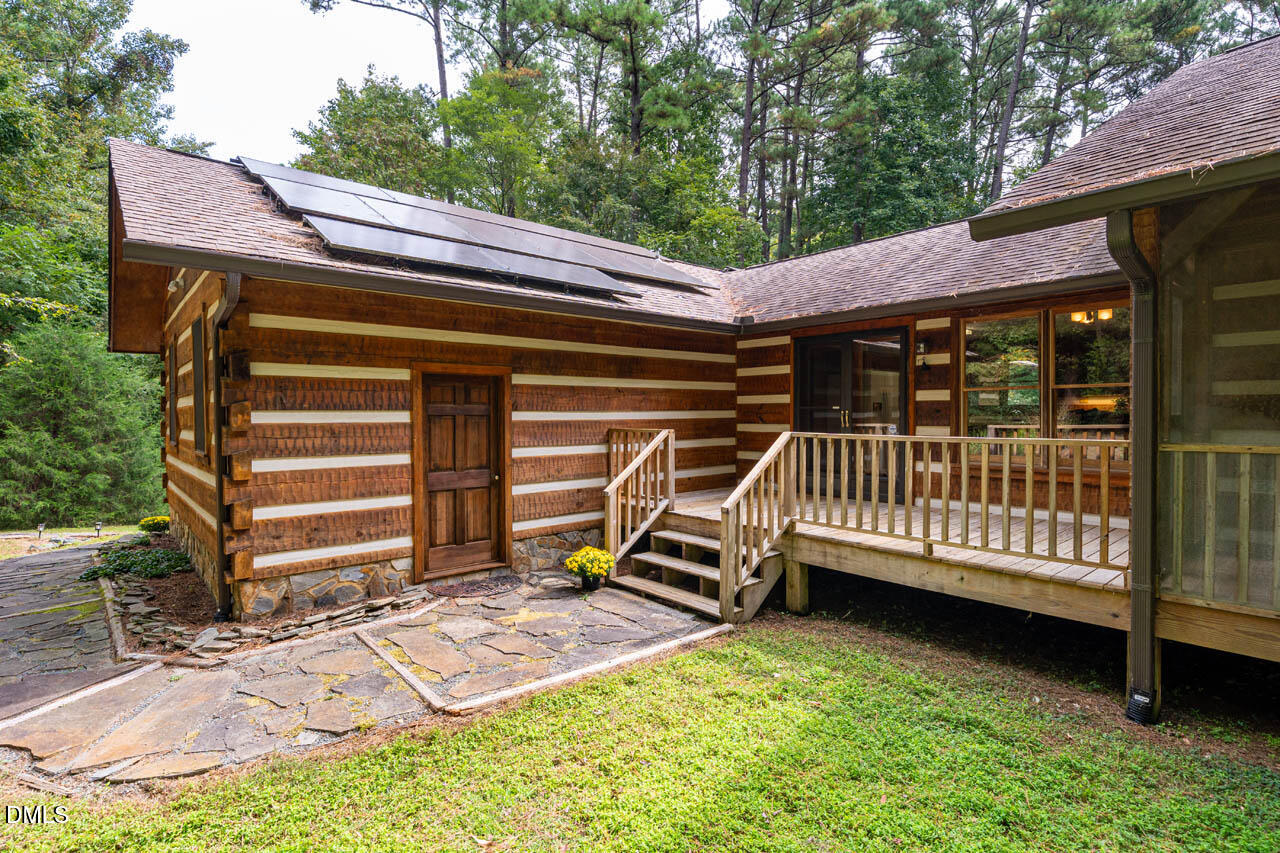 1114 Phil's Ridge Road Chapel Hill, NC 27516 - Photo 44 of 52 a view of a chair with a backyard