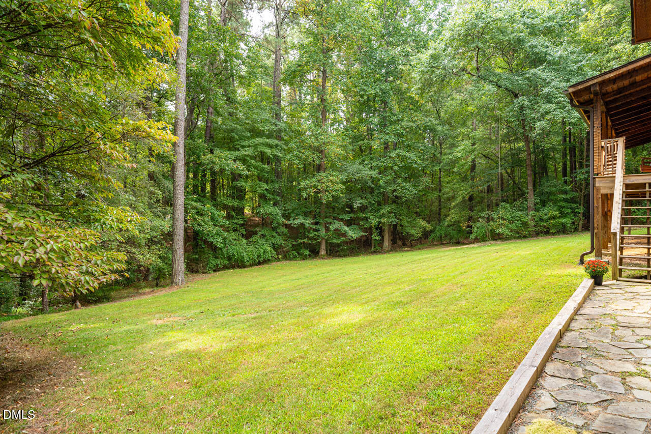 1114 Phil's Ridge Road Chapel Hill, NC 27516 - Photo 45 of 52 a view of a yard with an outdoor space