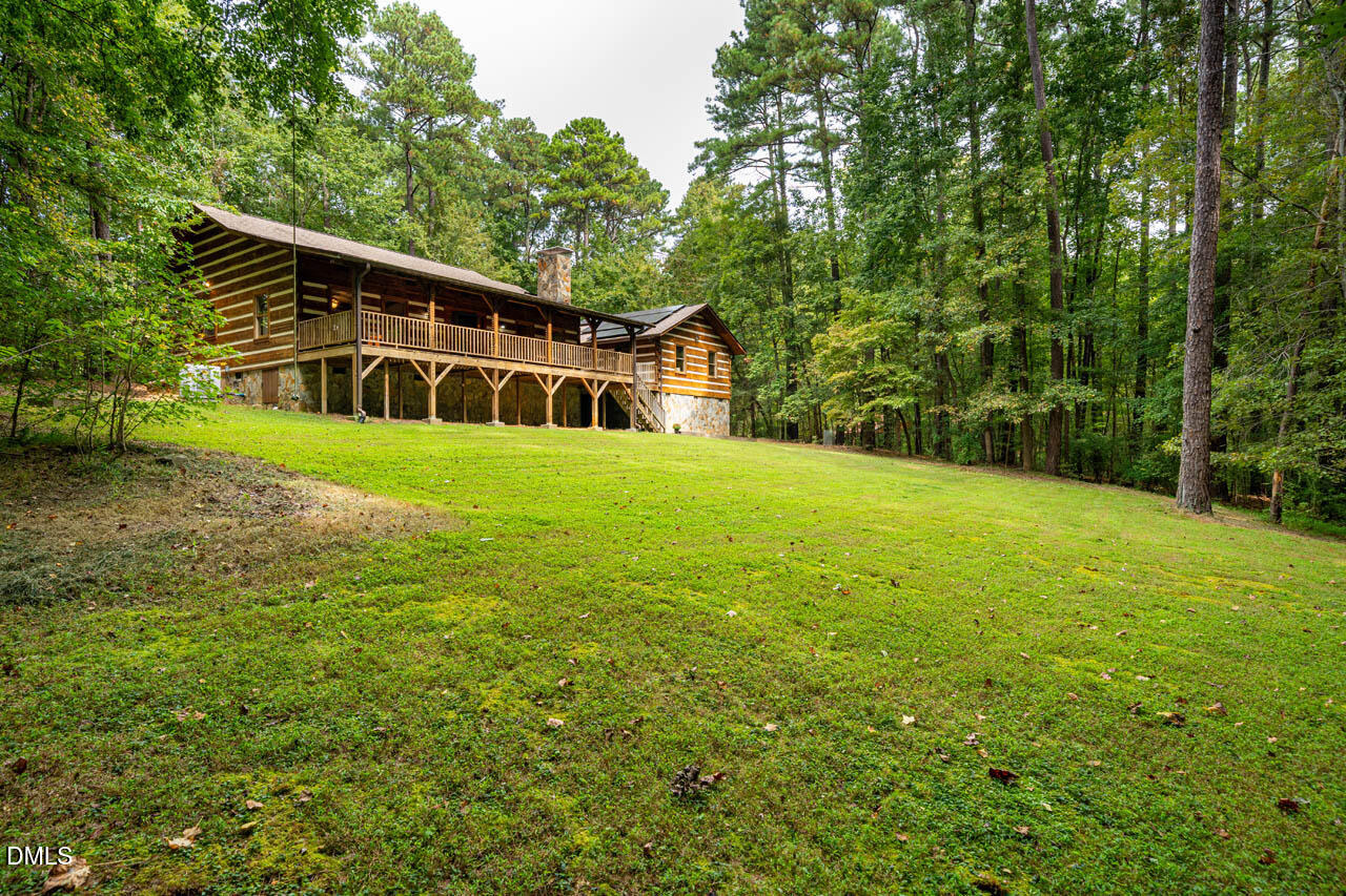 1114 Phil's Ridge Road Chapel Hill, NC 27516 - Photo 47 of 52 a view of a house with a yard
