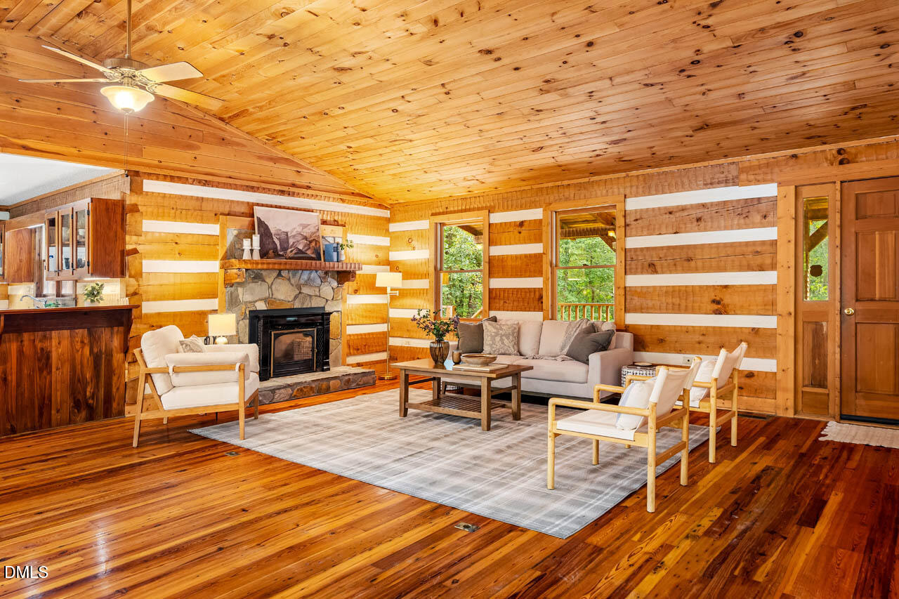 1114 Phil's Ridge Road Chapel Hill, NC 27516 - Photo 5 of 52 a living room with furniture and a fireplace