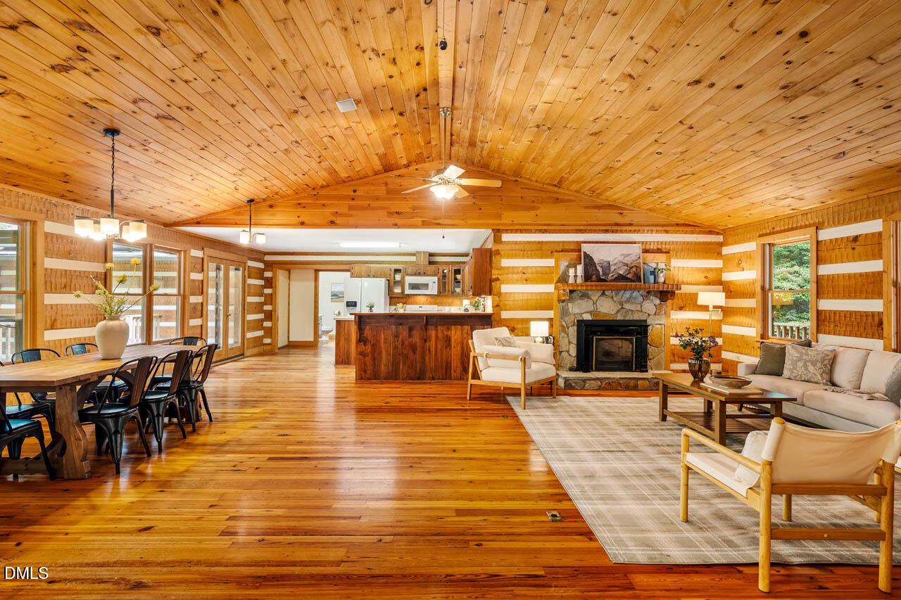 1114 Phil's Ridge Road Chapel Hill, NC 27516 - Photo 6 of 52 a living room with furniture and a fireplace