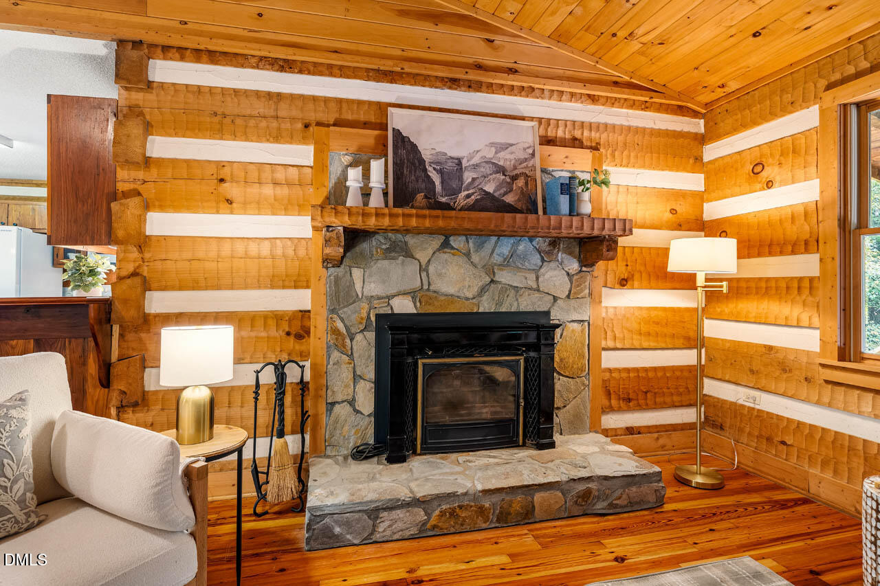 1114 Phil's Ridge Road Chapel Hill, NC 27516 - Photo 7 of 52 a living room with a furniture fireplace and a window