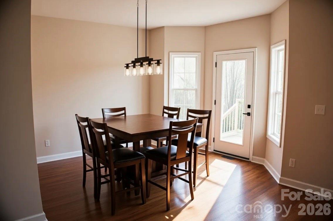 1304 Overhill Road Salisbury, NC 28144 - Photo 11 of 24 a view of a dining room with furniture window and wooden floor