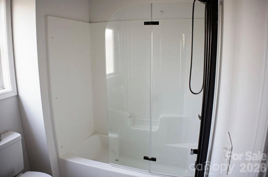 1304 Overhill Road Salisbury, NC 28144 - Photo 18 of 24 a bathroom with a glass shower door
