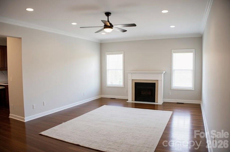 1304 Overhill Road Salisbury, NC 28144 - Photo 3 of 24 an empty room with windows and a fireplace