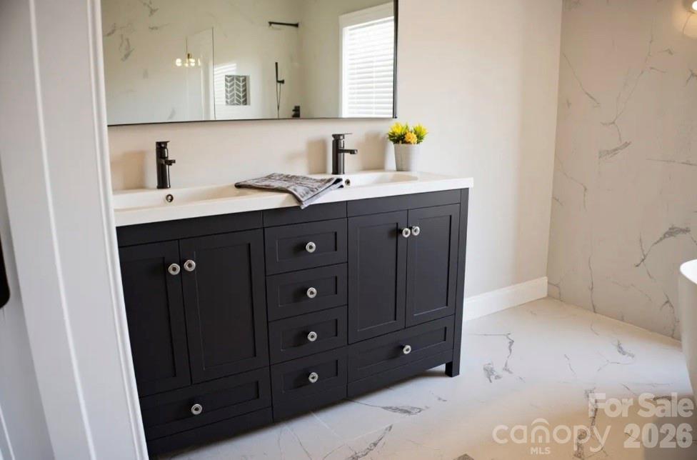 1304 Overhill Road Salisbury, NC 28144 - Photo 6 of 24 a bathroom with a sink vanity and mirror