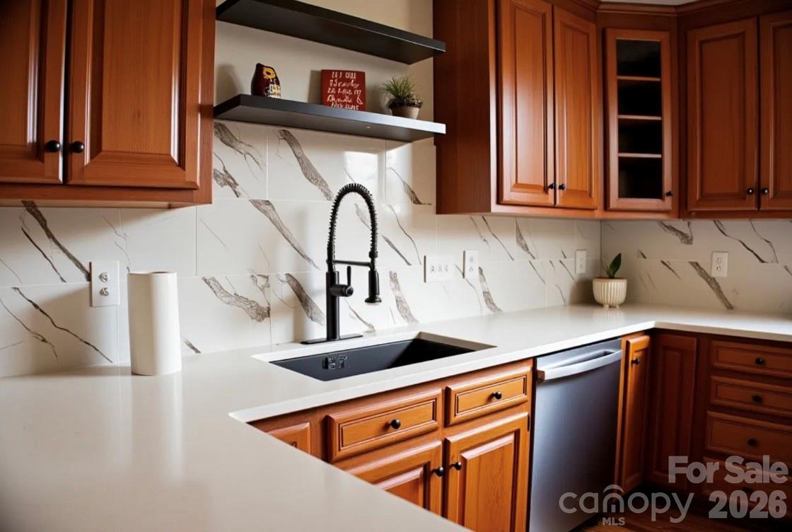 1304 Overhill Road Salisbury, NC 28144 - Photo 9 of 24 a kitchen with stainless steel appliances granite countertop a sink and cabinets