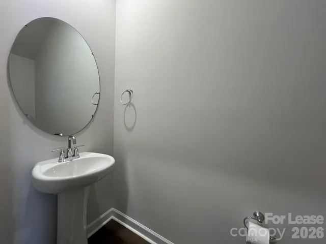 a bathroom with a sink and mirror