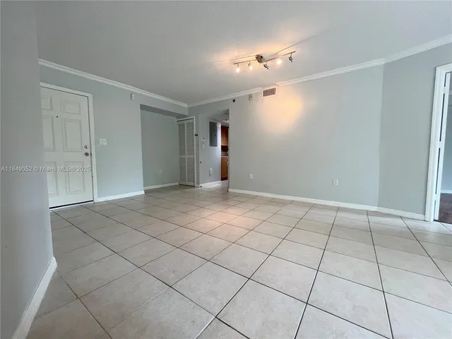 a view of an empty room with a fan