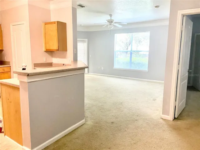 a bathroom with a granite countertop sink a mirror and a bathtub