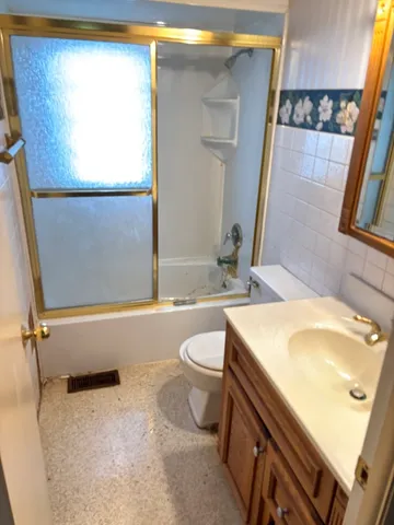 a bathroom with a sink a toilet and a bathtub