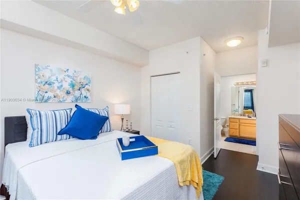 a bedroom with a bed and a couch