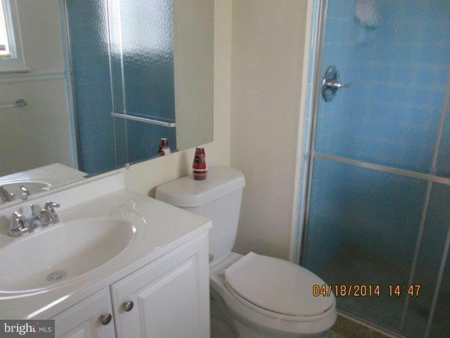 4700 Duncannon Road Baltimore, MD 21208 - Photo 11 of 15 a bathroom with a sink and a toilet