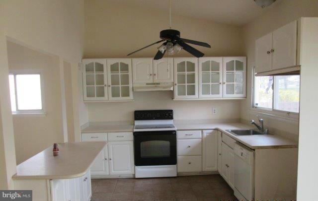 4700 Duncannon Road Baltimore, MD 21208 - Photo 5 of 15 a kitchen with cabinets appliances and a sink