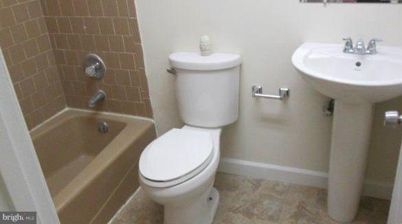 4700 Duncannon Road Baltimore, MD 21208 - Photo 6 of 15 a bathroom with a sink toilet and shower