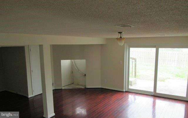 4700 Duncannon Road Baltimore, MD 21208 - Photo 7 of 15 a view of a livingroom with wooden floor and a window