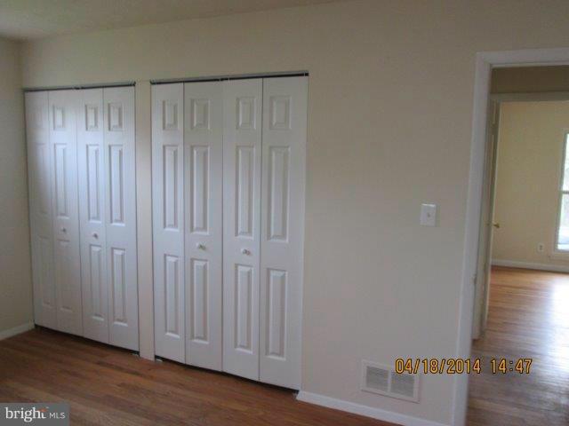 4700 Duncannon Road Baltimore, MD 21208 - Photo 10 of 15 a view of a hallway with wooden floor