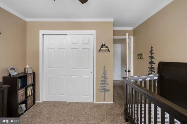 a view of a livingroom with furniture and an empty room