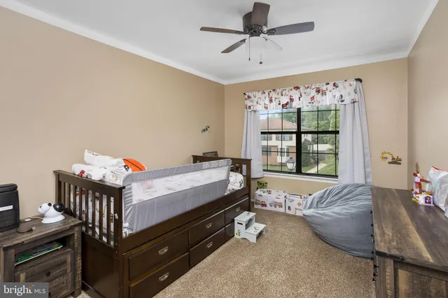 a bed room with a bed and a window