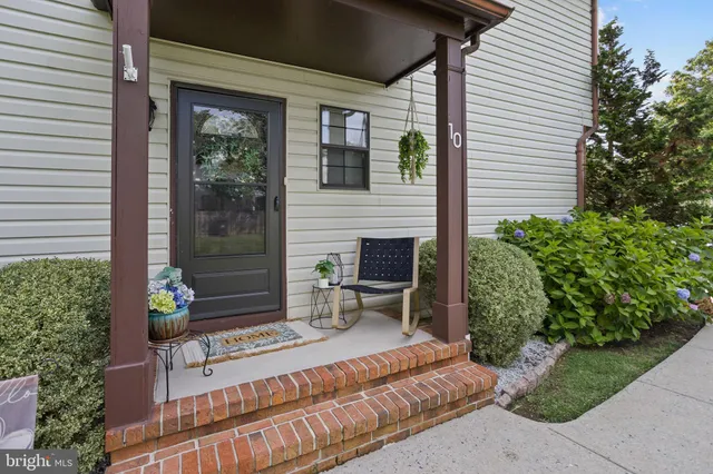 a view of a patio with a chairs and table in a patio