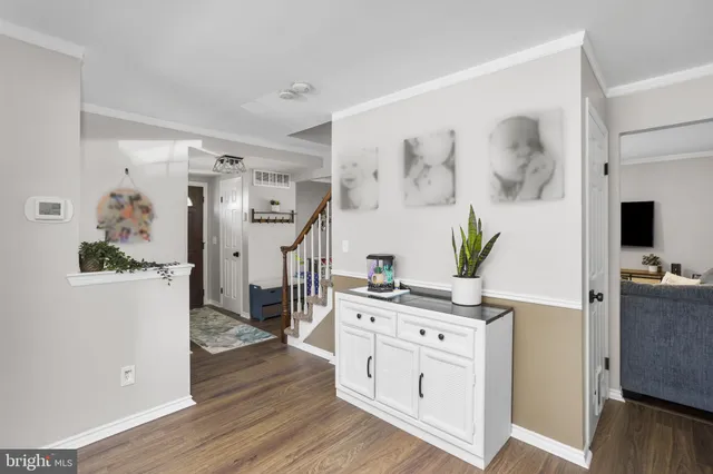 a view of kitchen with furniture and wooden floor