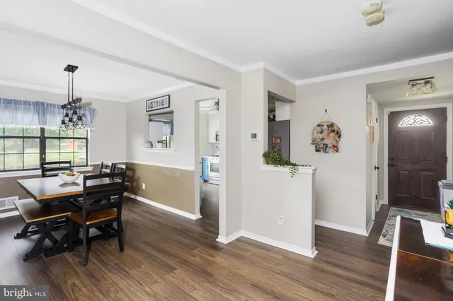 a view of a livingroom with furniture and wooden floor