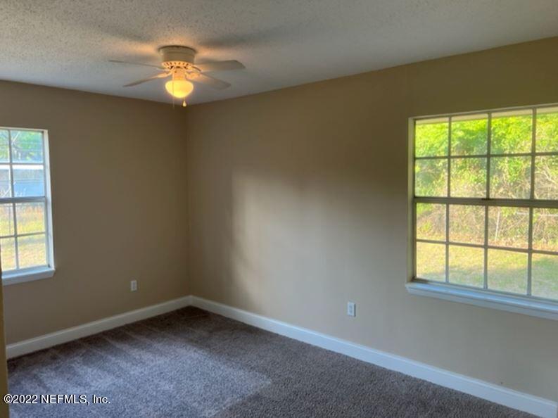 108 River Rd Drive Palatka, FL 32177 - Photo 5 of 11 an empty room with window
