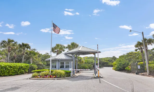 a spacious bedroom with a bed and a chandelier