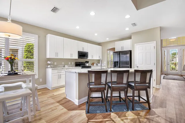 a bedroom with a bed dresser and a window