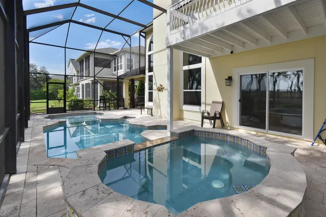 a kitchen with stainless steel appliances granite countertop a refrigerator stove top oven and sink