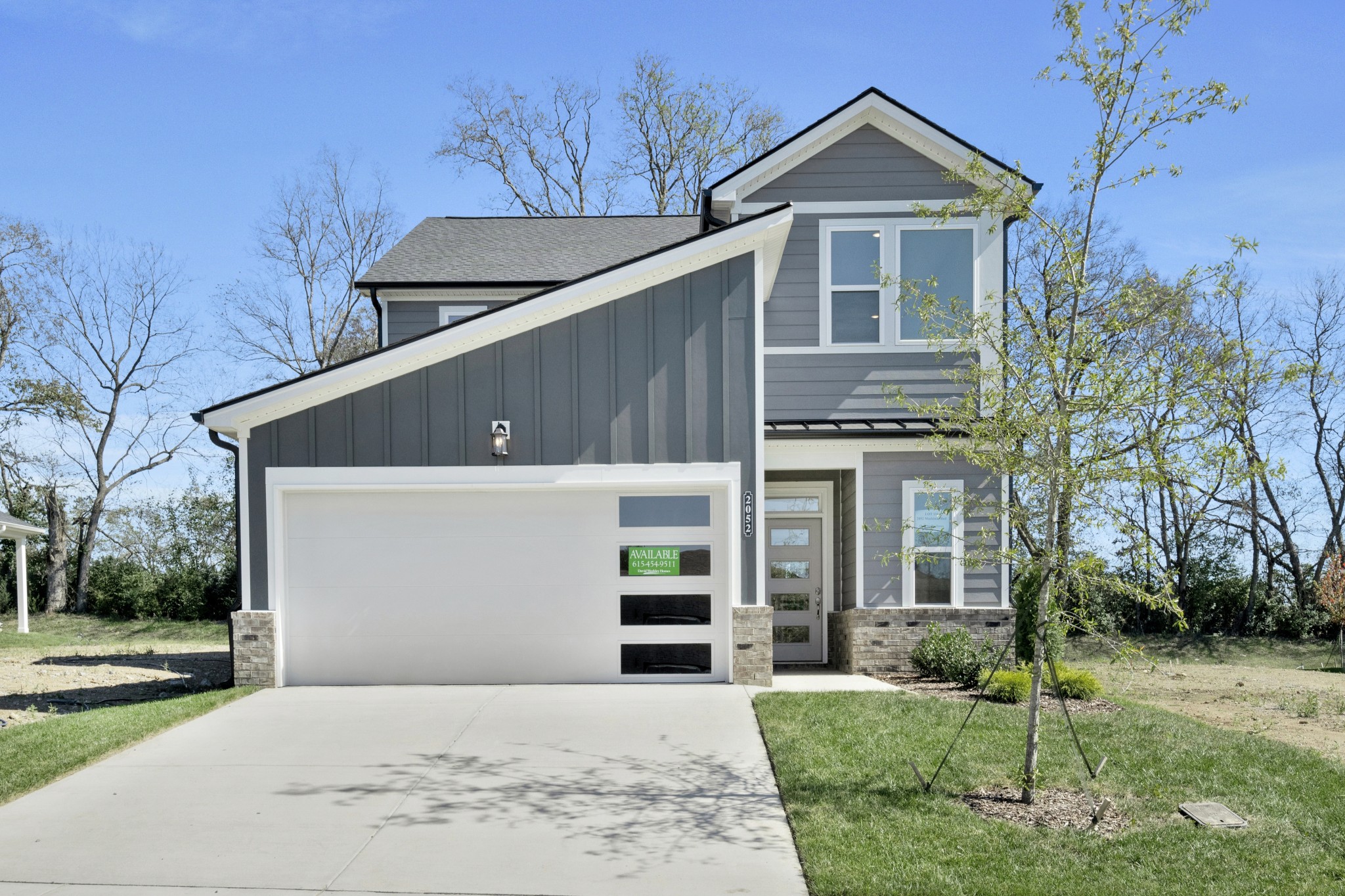 2052 Mackinac Bend Gallatin, TN 37066 - Photo 1 of 38 a front view of a house with a yard and garage