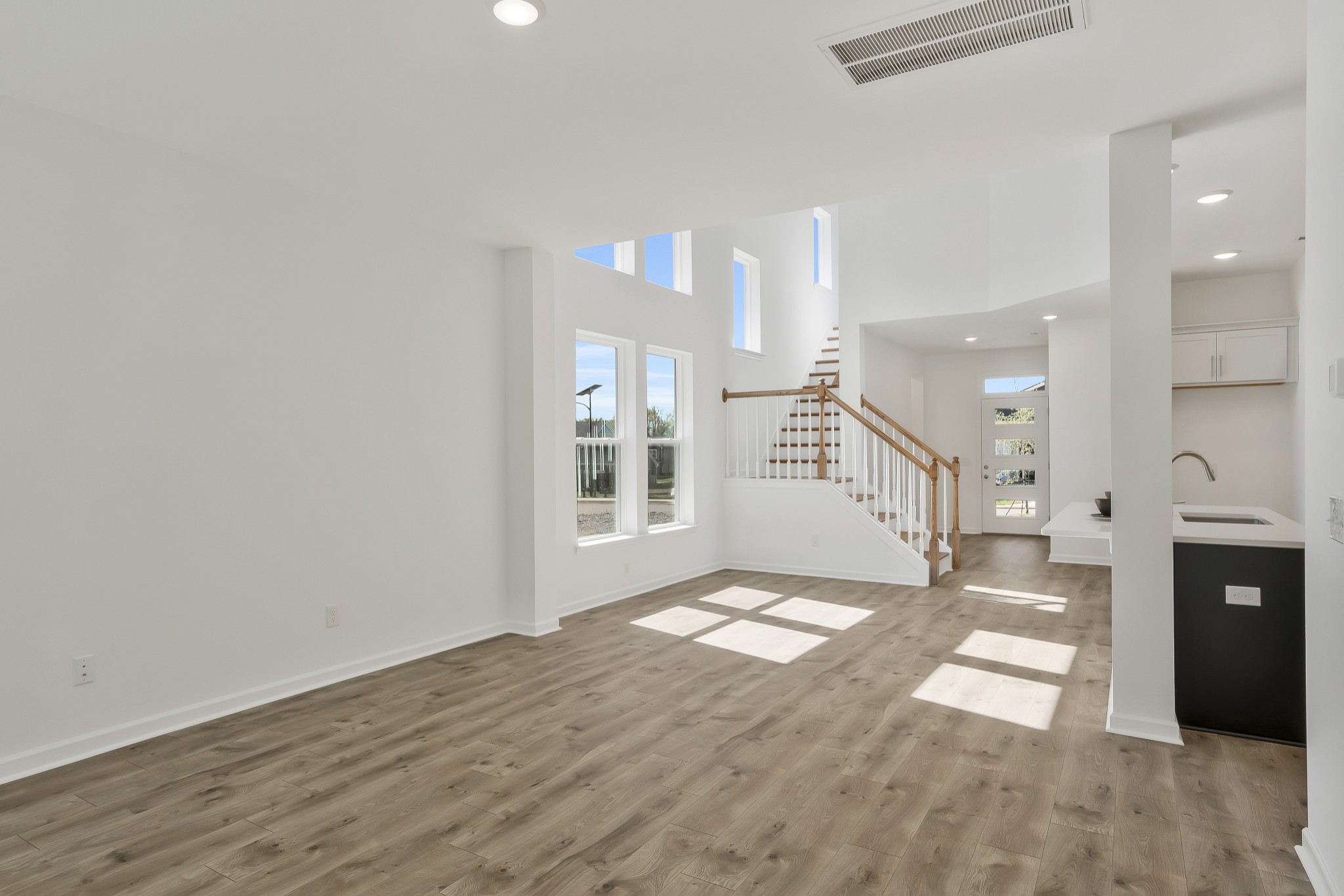 2052 Mackinac Bend Gallatin, TN 37066 - Photo 23 of 38 a view of a big room with windows and a fireplace