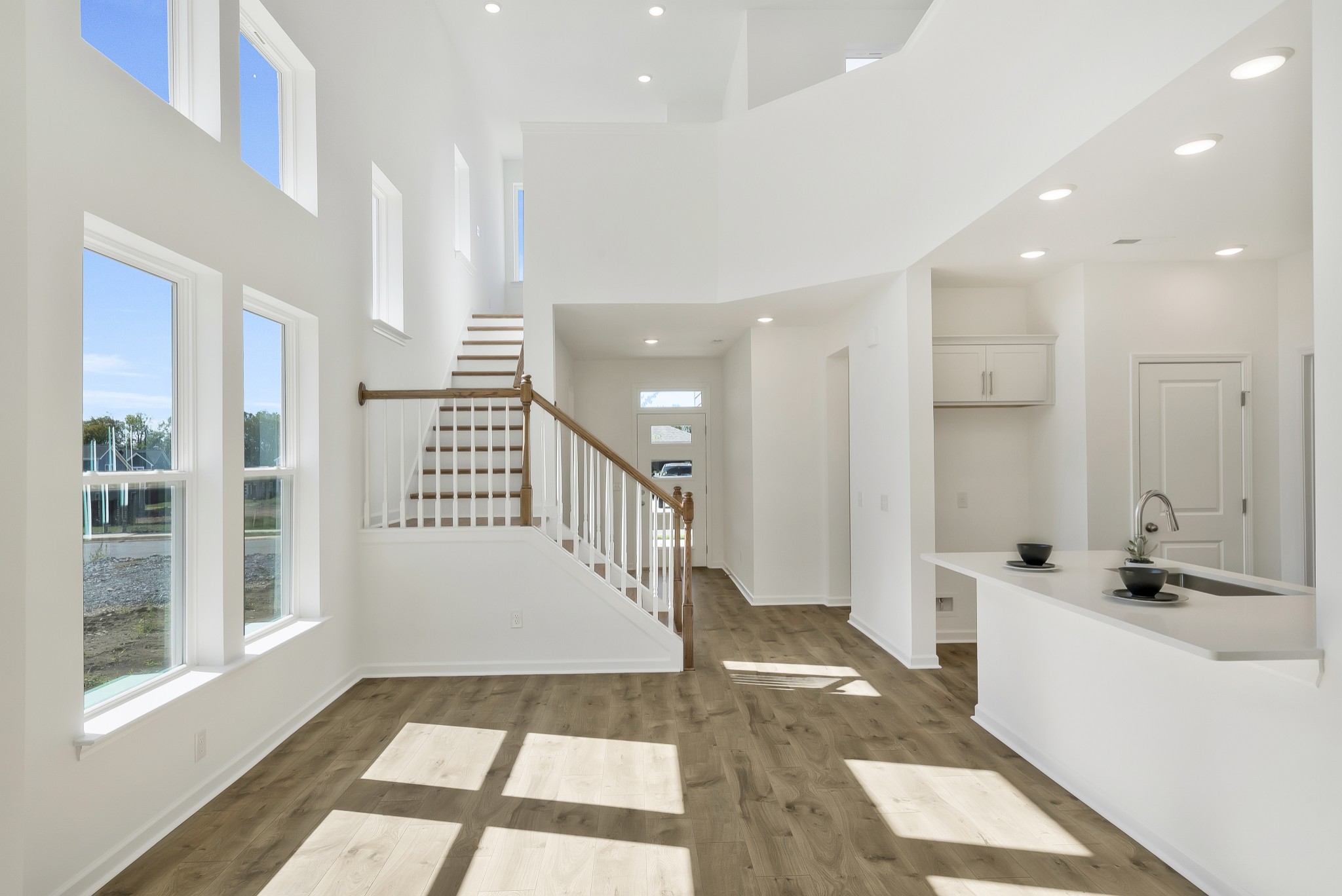2052 Mackinac Bend Gallatin, TN 37066 - Photo 24 of 38 a view of a hallway to a bedroom with wooden floor and windows
