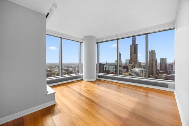 a spacious bathroom with a double vanity sink toilet and a tub