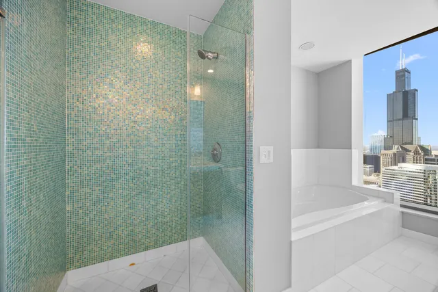 a view of a room with wooden floor and bathroom sink