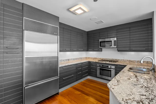 a view of balcony with floor to ceiling window and wooden floor
