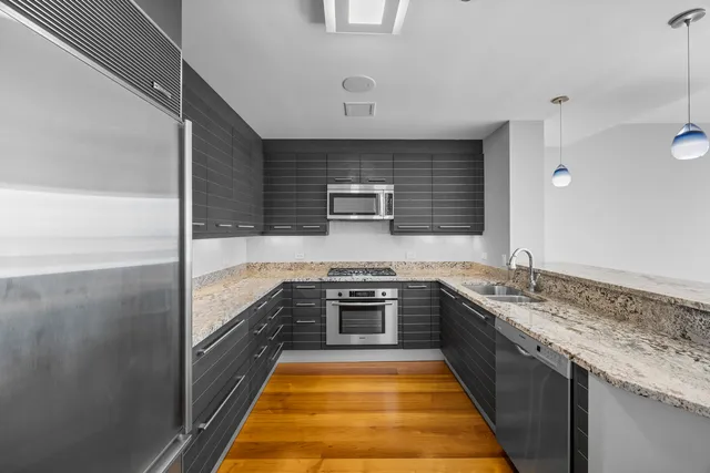 a room with a bed and a large window