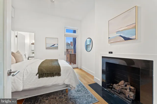 a kitchen with granite countertop stainless steel appliances a stove a sink and a refrigerator