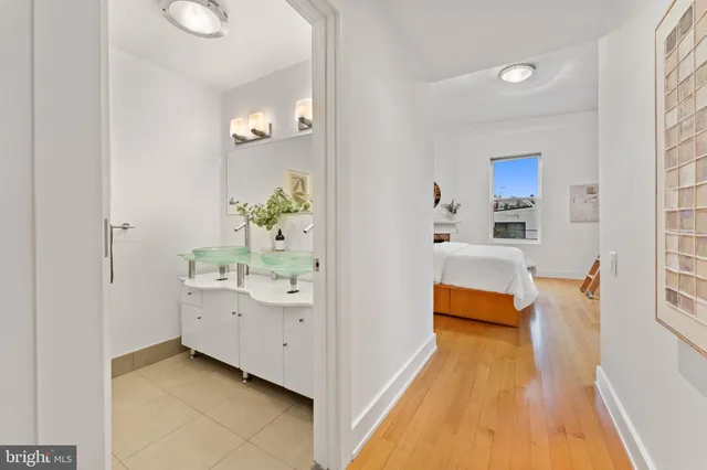 a view of a hallway with washer and dryer