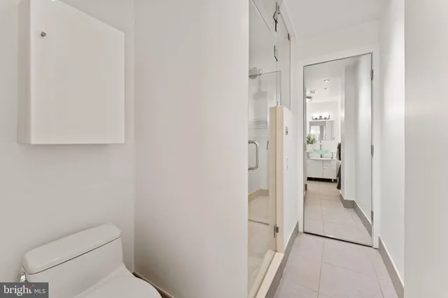 a bathroom with a double vanity sink and mirror