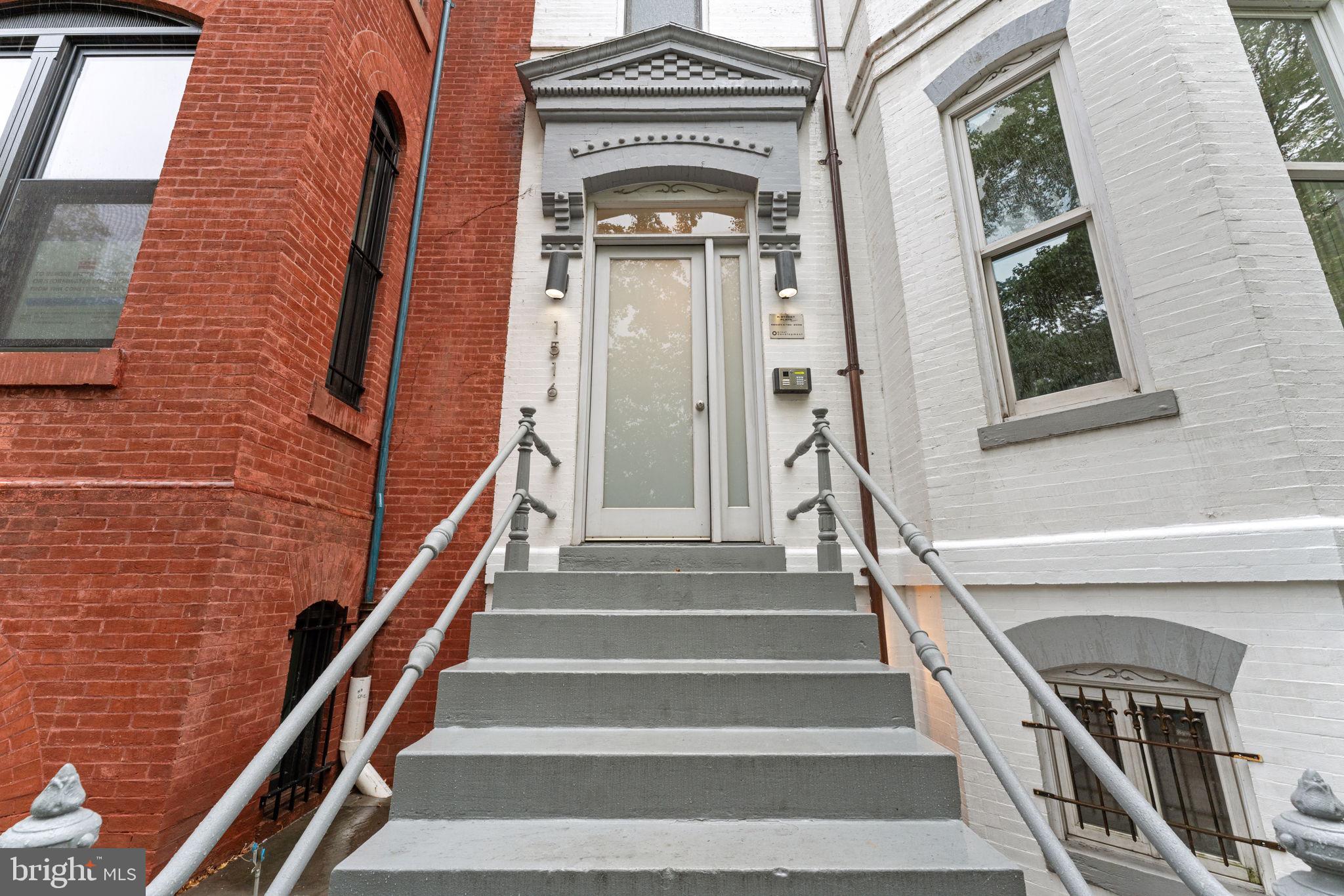 1516 R Street Northwest, Unit 3 Washington, DC 20009 - Photo 27 of 29 a view of staircase with a fireplace