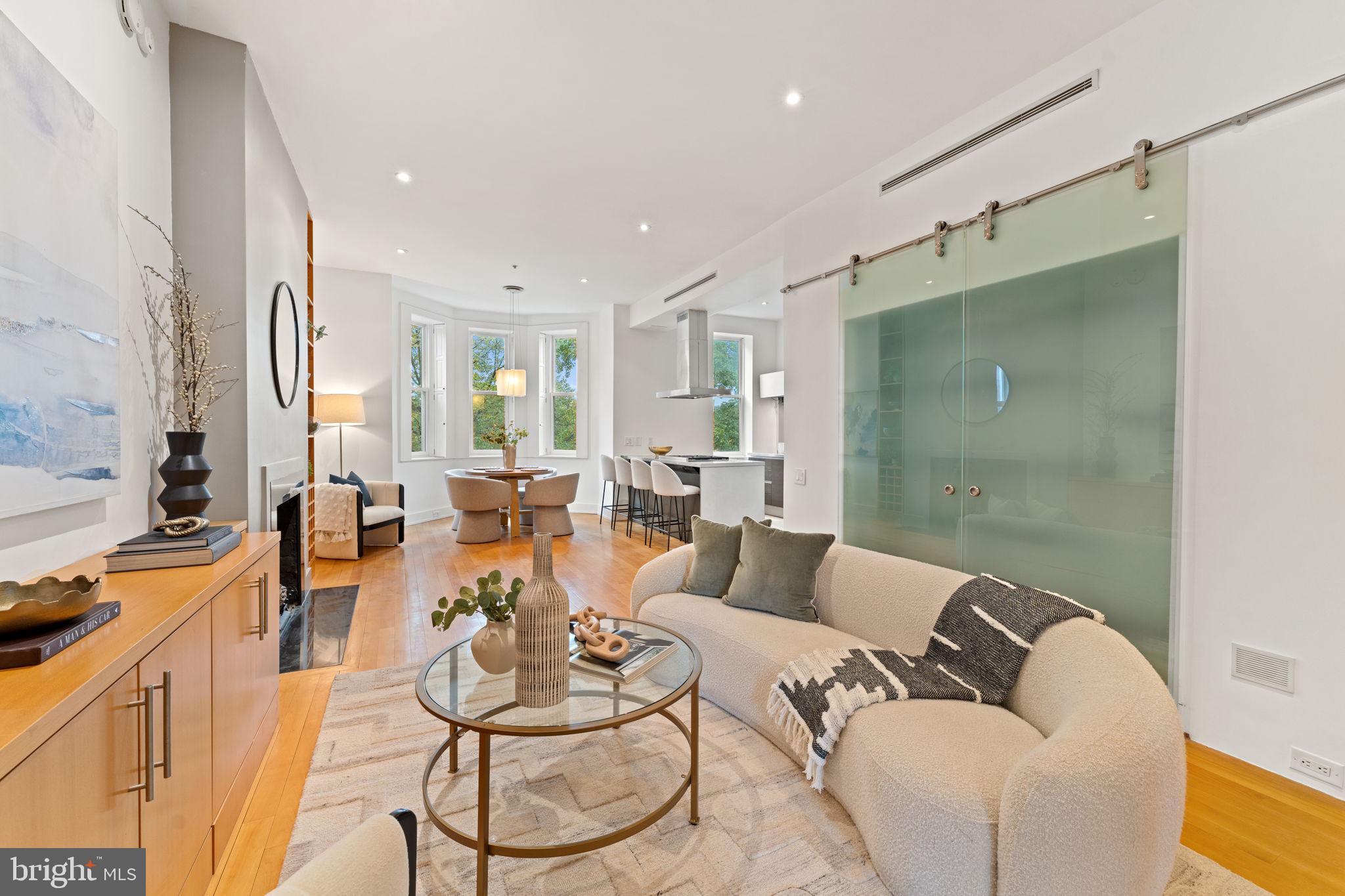 1516 R Street Northwest, Unit 3 Washington, DC 20009 - Photo 29 of 29 a living room with furniture and a chandelier