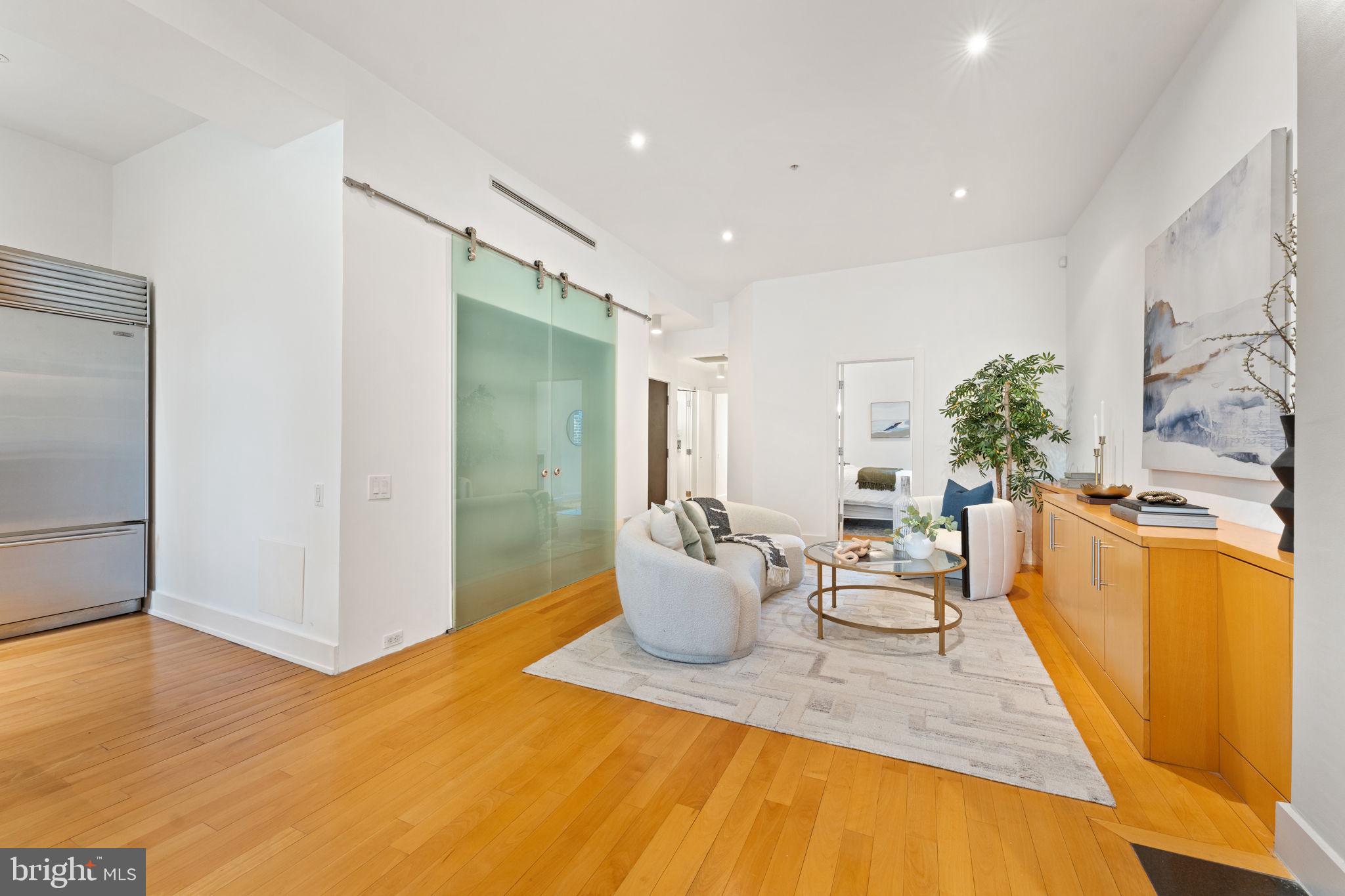 1516 R Street Northwest, Unit 3 Washington, DC 20009 - Photo 4 of 29 a living room with furniture and a table