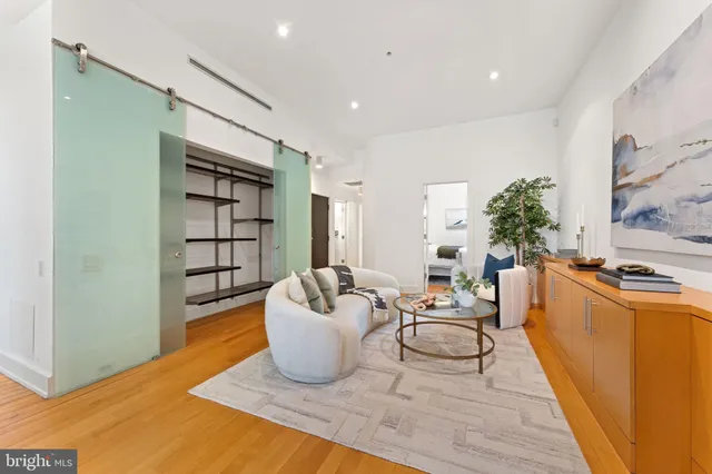 a living room with furniture and a table