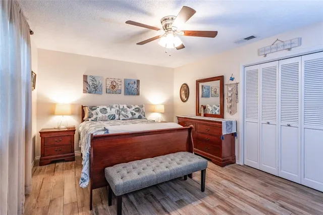 a bedroom with a bed and a dresser in it