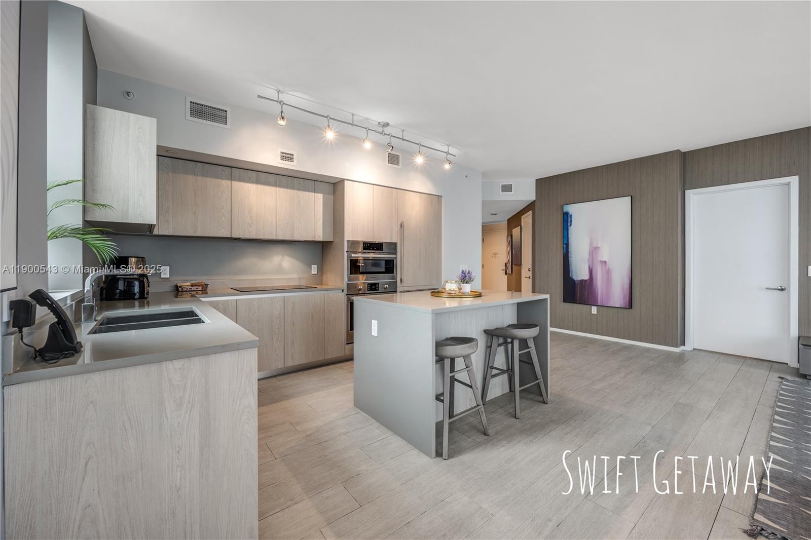 4010 South Ocean Drive, Unit R2501 Hollywood, FL 33019 - Photo 13 of 20 a kitchen with a sink cabinets and window